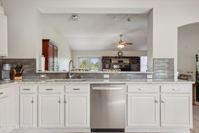 kitchen with white cabinetry, dishwasher, and kitchen peninsula