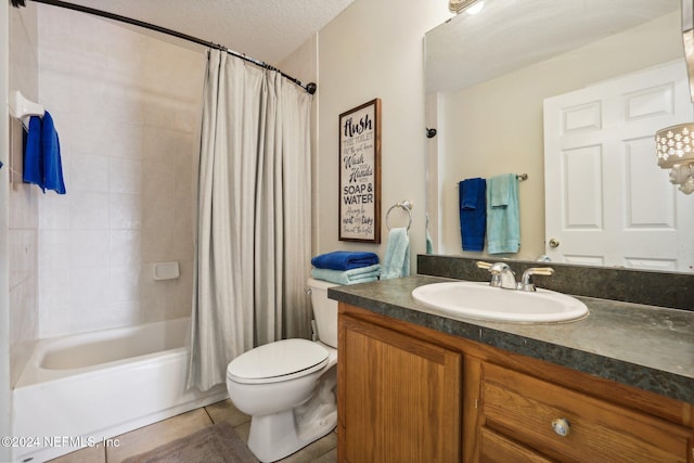 full bathroom featuring a textured ceiling, toilet, tile patterned floors, vanity, and shower / tub combo with curtain