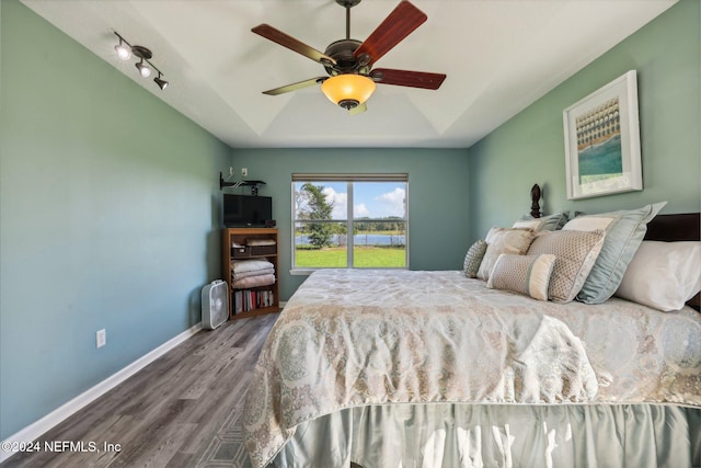 bedroom with hardwood / wood-style flooring and ceiling fan