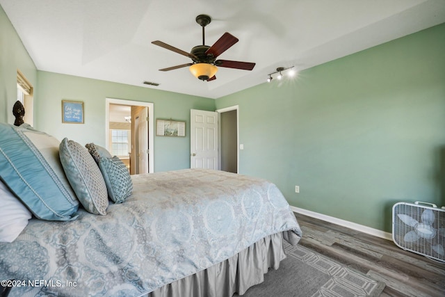 bedroom featuring dark hardwood / wood-style flooring and ceiling fan