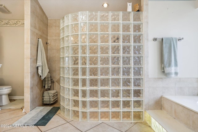 bathroom with toilet, tile patterned floors, and plus walk in shower