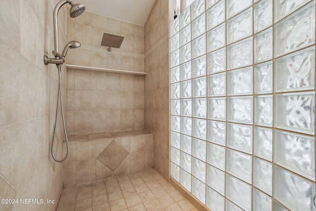 bathroom with tiled shower