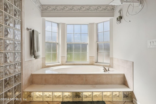 bathroom with a tub to relax in