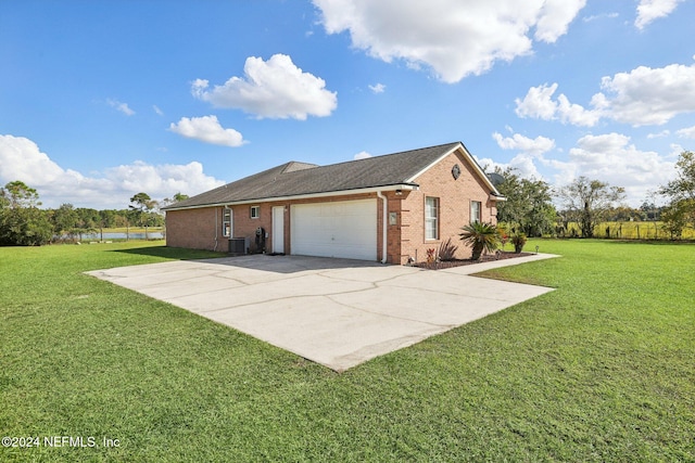 view of side of property featuring a yard and a garage