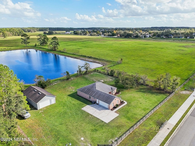 birds eye view of property with a rural view and a water view