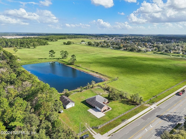 drone / aerial view featuring a water view and a rural view