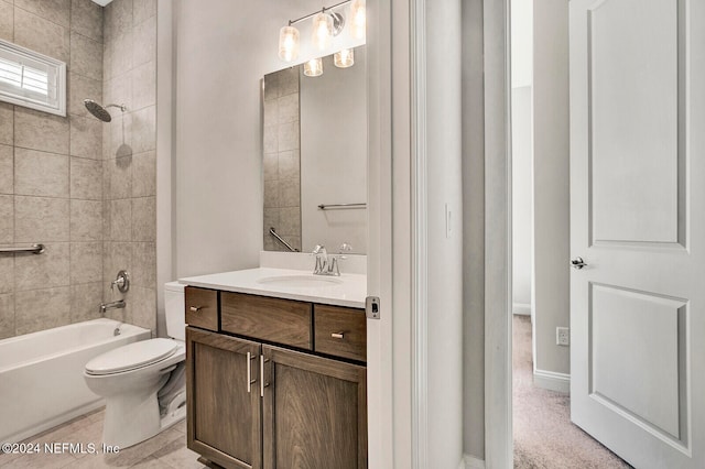 bathroom featuring toilet, tub / shower combination, and vanity