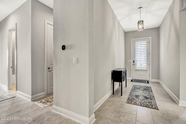 foyer entrance with baseboards