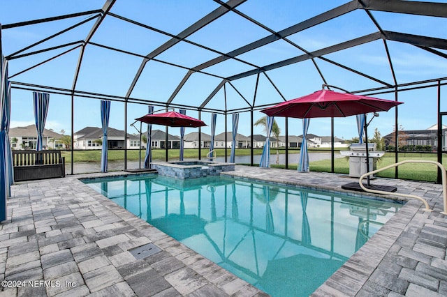 view of swimming pool with a patio area, a residential view, a lawn, a pool with connected hot tub, and glass enclosure