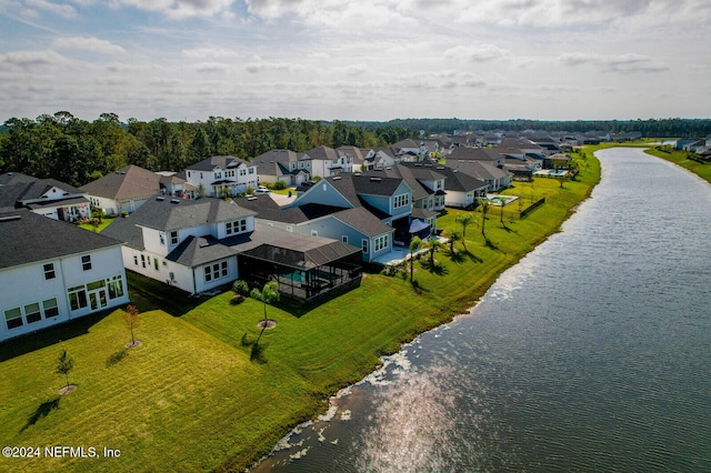 birds eye view of property featuring a water view and a residential view