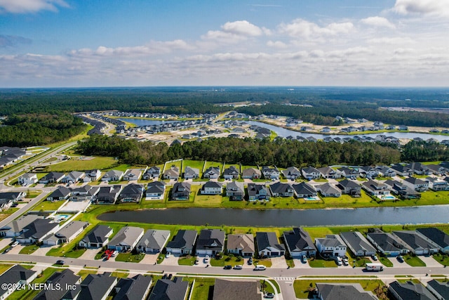 bird's eye view with a water view and a residential view