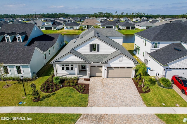 aerial view with a residential view and a water view