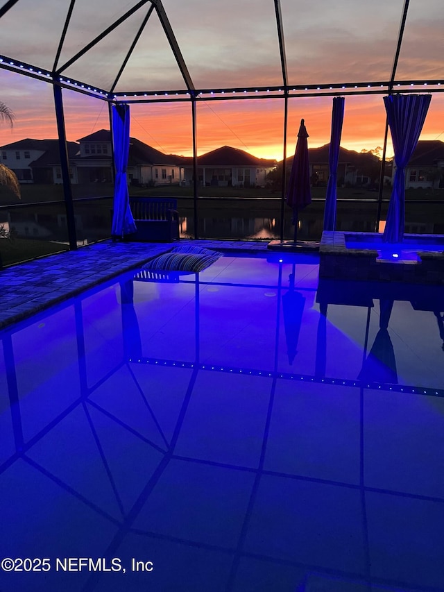 view of pool with a pool with connected hot tub