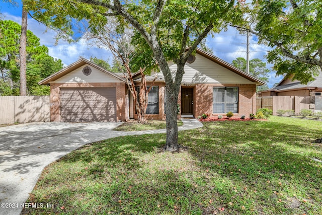 single story home with a front yard and a garage