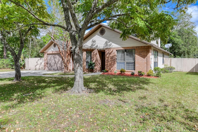 ranch-style home with a front yard and a garage