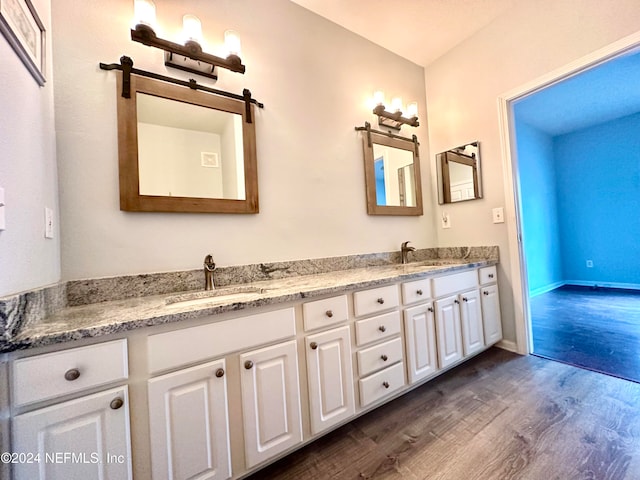 bathroom featuring vanity and hardwood / wood-style flooring