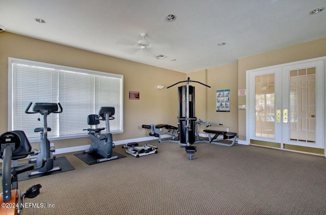 workout area featuring french doors, carpet flooring, plenty of natural light, and ceiling fan