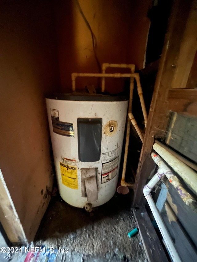 utility room featuring water heater