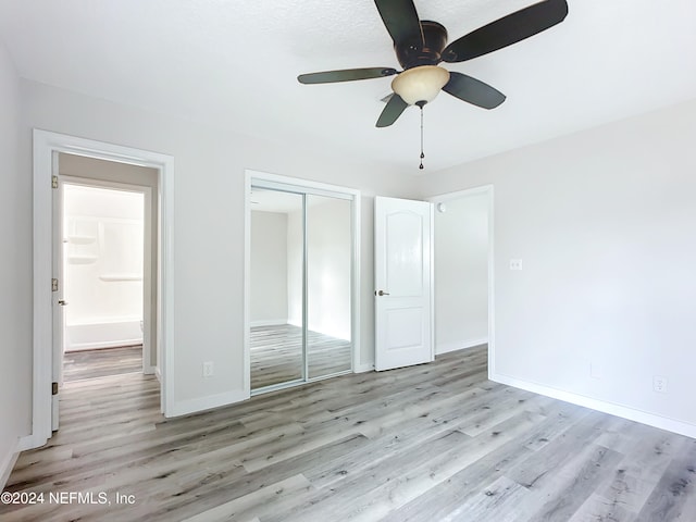 unfurnished bedroom featuring a closet, ceiling fan, and light hardwood / wood-style floors