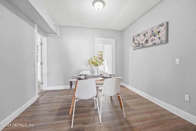 dining area with wood-type flooring