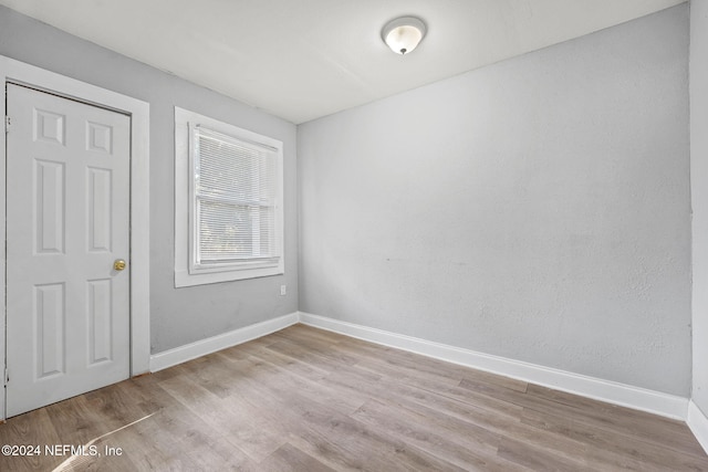 unfurnished room with light hardwood / wood-style floors