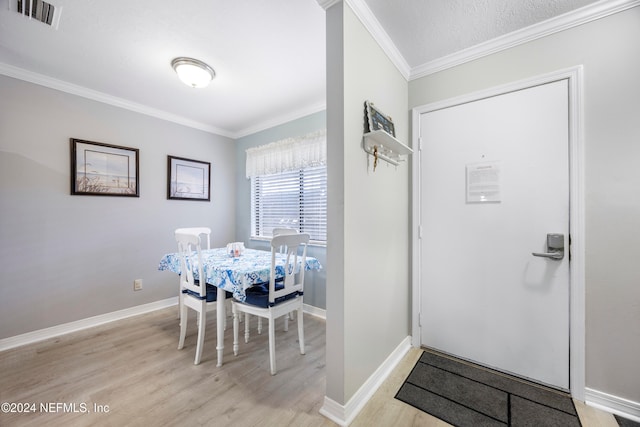 interior space featuring light hardwood / wood-style flooring and ornamental molding