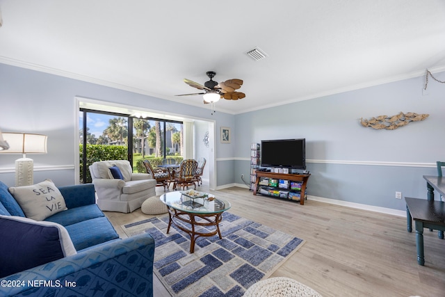 living room with ceiling fan, light hardwood / wood-style floors, and ornamental molding