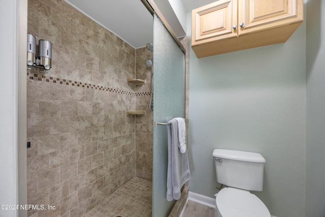 bathroom with toilet and walk in shower