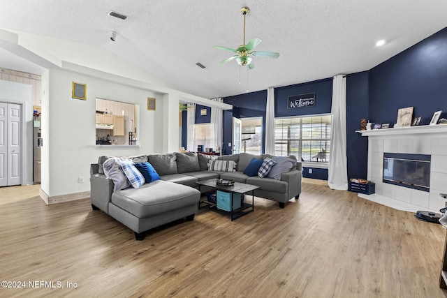 978 Tammy Cove Ln, Jacksonville, FL 32218 - living area with ceiling fan, vaulted ceiling, baseboards, and light wood-style floors