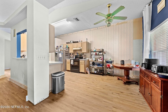 kitchen featuring wooden walls, light hardwood / wood-style flooring, black range with electric cooktop, a textured ceiling, and ceiling fan