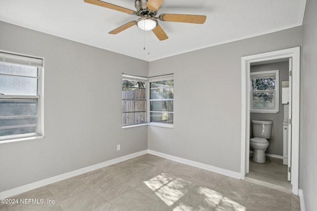 3730 Abby Ln, Jacksonville, FL 32207 - unfurnished bedroom with ensuite bathroom, multiple windows, crown molding, and ceiling fan