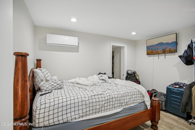 3730 Abby Ln, Jacksonville, FL 32207 - bedroom featuring a wall mounted air conditioner and light wood-type flooring