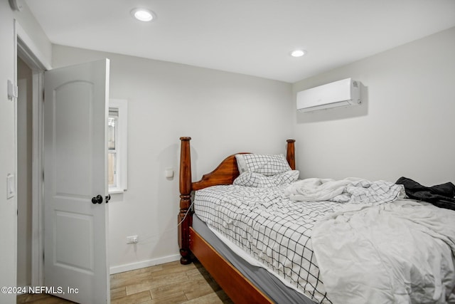 3730 Abby Ln, Jacksonville, FL 32207 - bedroom with a wall unit AC and light wood-type flooring