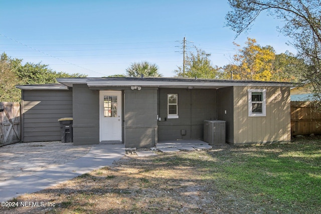 3730 Abby Ln, Jacksonville, FL 32207 - rear view of house with central AC, a yard, and a patio