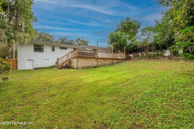 view of yard with a wooden deck