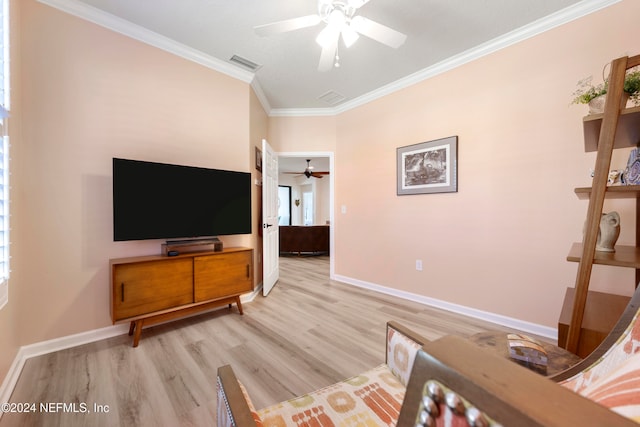 interior space with light hardwood / wood-style floors, crown molding, and ceiling fan