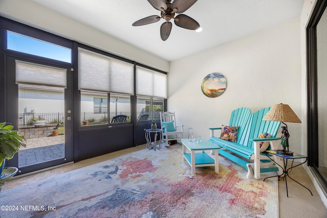 sunroom featuring ceiling fan