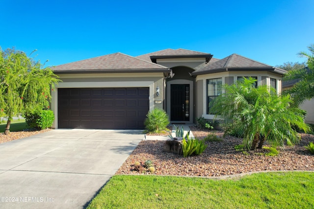 prairie-style home featuring a garage