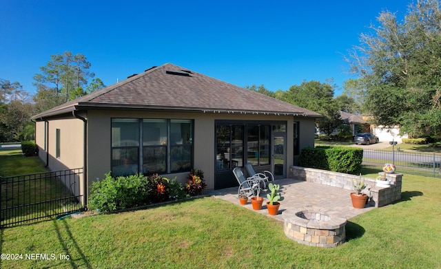 back of house featuring a patio and a lawn