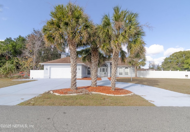 view of front facade featuring a garage and a front yard