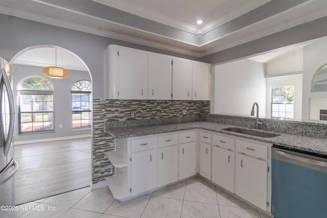 kitchen with white cabinets, sink, appliances with stainless steel finishes, and dark stone counters