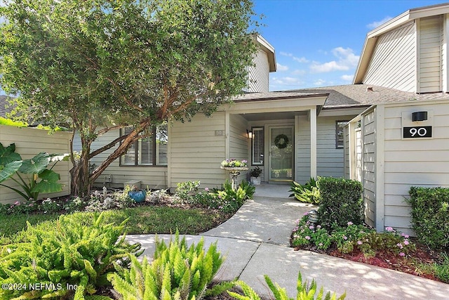 doorway to property with a porch