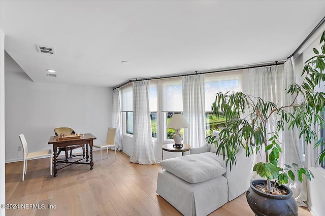 sitting room featuring light hardwood / wood-style floors