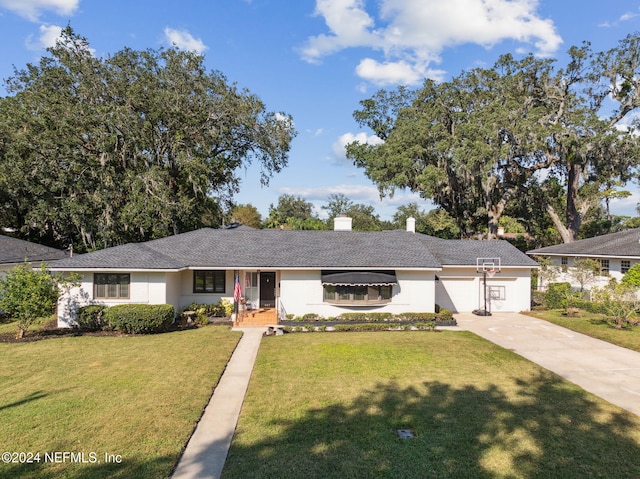 ranch-style home featuring a front yard