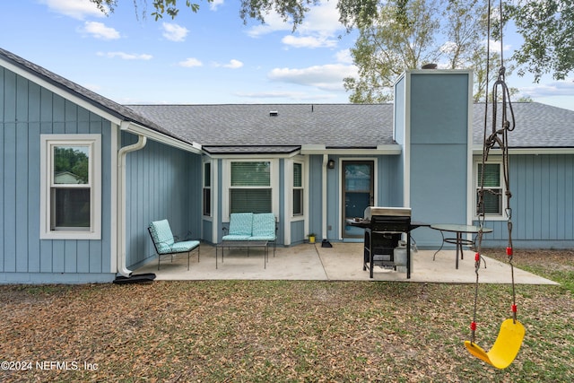 rear view of property with a patio