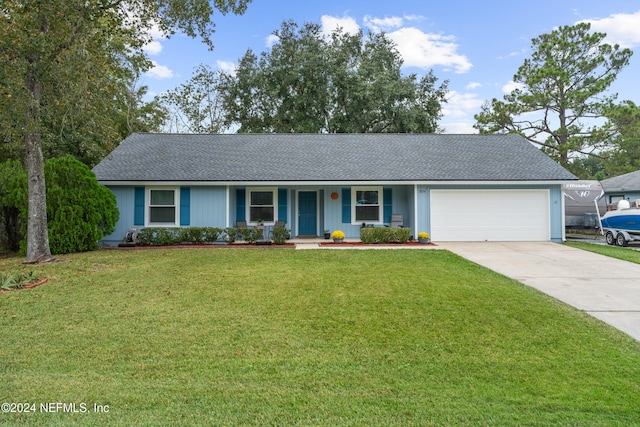 ranch-style home featuring a porch, a front lawn, and a garage