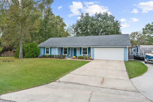 single story home featuring central AC, a front lawn, and a garage