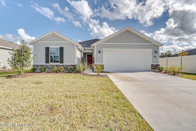 2320 Dallas Creek Ln, Green Cove Springs, FL 32043 - view of front facade with stone siding, driveway, and an attached garage