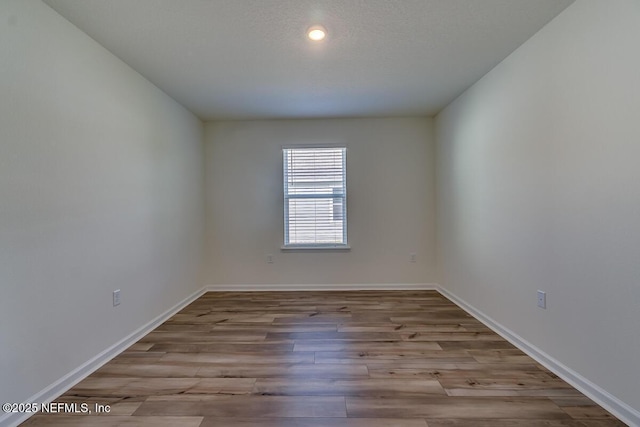 2320 Dallas Creek Ln, Green Cove Springs, FL 32043 - empty room featuring wood finished floors, baseboards, and recessed lighting