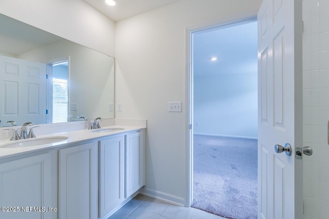 2320 Dallas Creek Ln, Green Cove Springs, FL 32043 - bathroom featuring double vanity, tile patterned floors, and baseboards